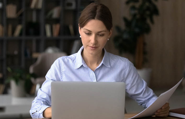 Person using laptop.