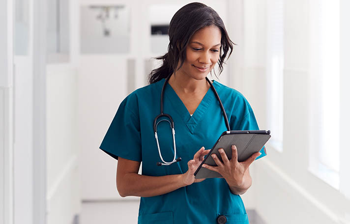 Doctor using tablet computer.